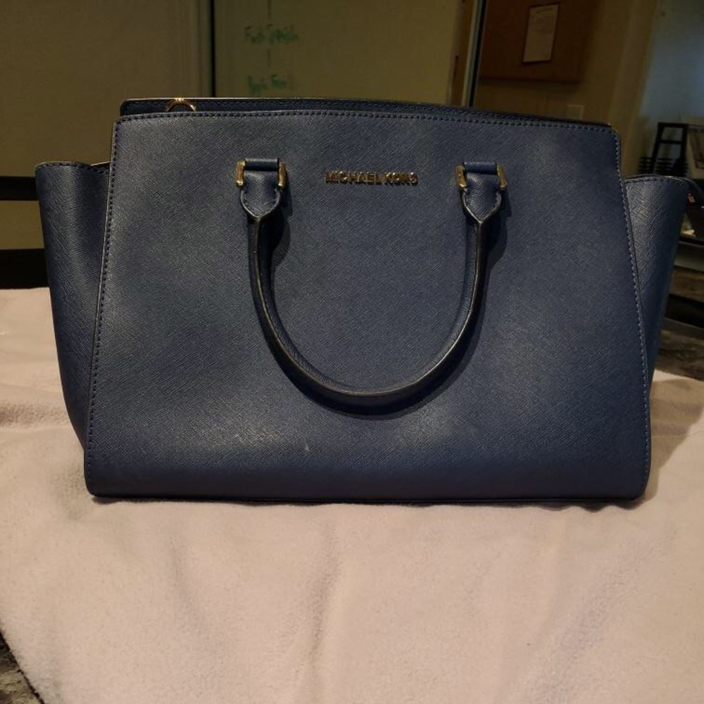 Blue Michael Kors tote bag.